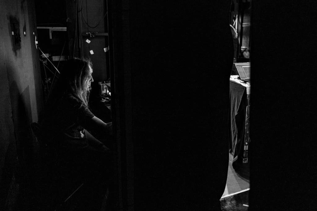 A shot from backstage. Marc possibly sits on the production desk checking things. You can’t see the desk as it is hidden behind a pilar.