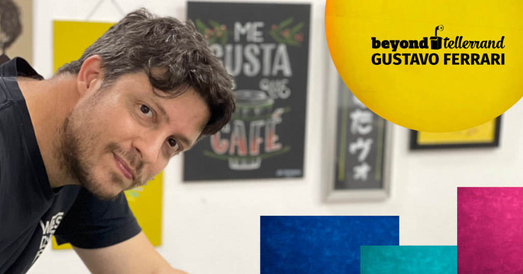 A photo of Gustavo Ferrari at work, painting fully conentrated