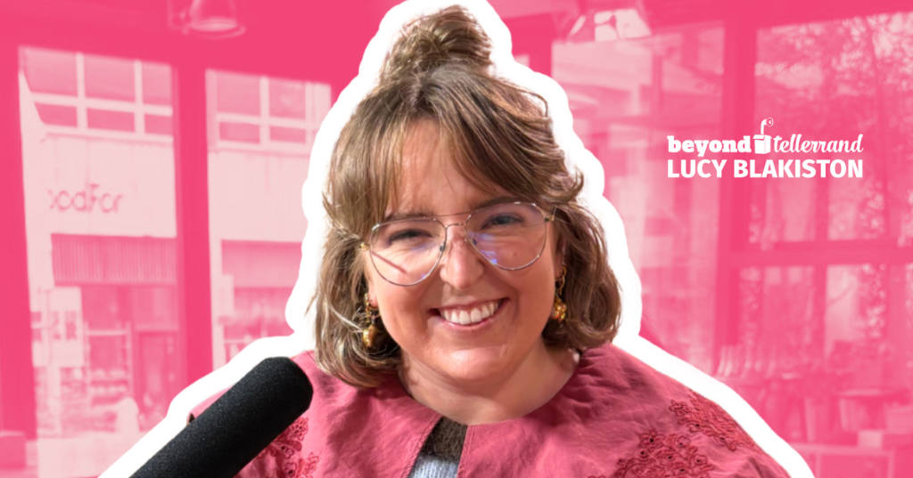 Lucy Blakiston headshot with her smiling in fron of a pink background