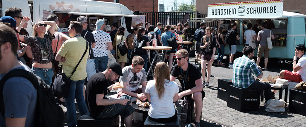 Attendees sitting outside during the event break