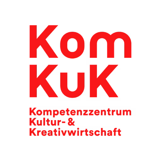 The logo of our partner KomKuK