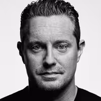 A photo with a portrait of Burton Rast