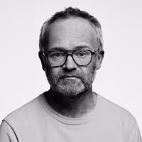 A photo with a portrait of Wilfrid Wood