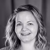 A portrait shot of Stephanie Eckles. She is smiling into the camera with a straight look into the camera.