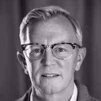 A portrait photo of Aarron Walter who looks straight into the camera, gently smiling